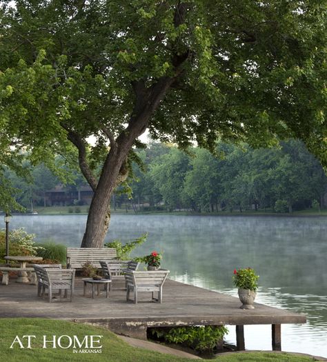 On the dock, weathered teak furniture provides a place to take in the view of the North Little Rock Lake. Lake Dock, Lakeside Living, Lake Living, Lake Cottage, Body Of Water, Lake Cabins, River House, Home Design Decor, Lighting Inspiration