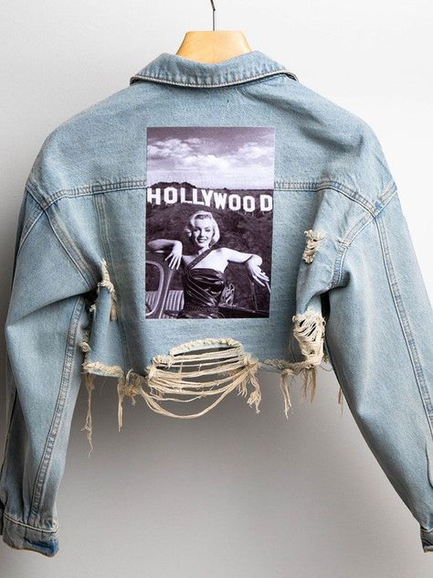 Crop distressed denim jacket, featured graphic photo of Marilyn Monroe, front button down and front pockets. " fear is stupid " embroidered on sleeve. All jackets are handmade. cotton/rayon polyester Graphic Jean Jacket, Graphic Denim Jacket, Embroidery On Denim Jackets, Lash Merch, Denim Jacket Art, Denim Jacket Back, Denim Jacket Diy Paint, Graphic Photo, Crop Denim Jacket