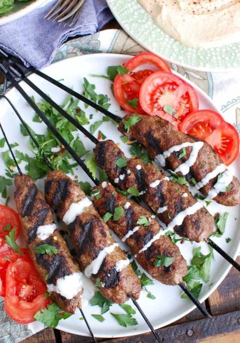 Grilled Beef Kafta Kebabs are easy to prepare and use warm, rich Middle Eastern spices. You can eat the beef kebabs in a pita sandwich or on a plate of hummus with pita on the side.  // acedarspoon.com #beef #kafta #beefkebabs #grilling #kebabs #Mediterra Kafta Kabob Recipe, Beef Kafta, Pita Sandwich, Lamb Kabobs, Beef Kebabs, Grilling Ideas, Grilling Kabobs, Kebabs On The Grill, Kabob Recipes