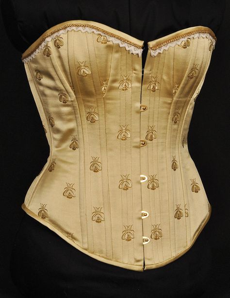 This is a victorian corset made of Chinese silk brocade with embroidered honey bees. It consists of two layers of white coutil, gold grommets in the back and a gold busk. Made for a friend who happ... Bee Corset, Bee Clothes, Bee Items, Bee Clothing, Butterfly Corset, Corset Victorian, Honey Dress, Gold Corset, Wedding Corset