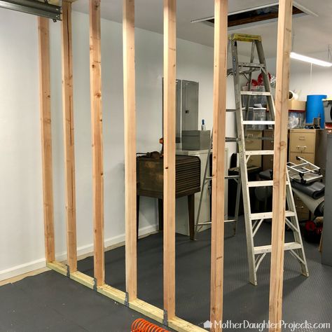 How to Build a Garage Storage Wall - Mother Daughter Projects Building A Room Inside A Garage, Storage Room In Garage, Garage Storage Concrete Walls, Garage Wall Divider, Garage Room Divider Ideas, Temporary Wall In Garage, Garage Separation Wall, Garage Divider Wall, Garage Partition Wall