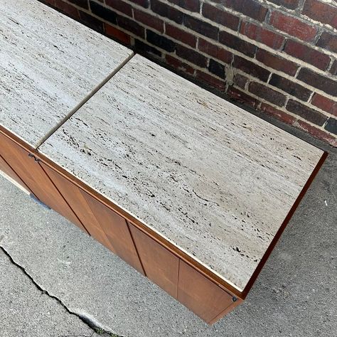 Floating credenza bar with travertine top and built in wine storage. Comes with chrome mounting brackets for wall. This piece is serious. The cabinet has 8 bifold door revealing 4 different compartments one has bottle storage another has drawers and two have glass shelving. This is the kind of piece that makes a room or truly a room can be built around. Wall Mounted Credenza, Travertine Cabinet, Bifold Door, Commercial Bar Cabinets Wall Mount, Stone Credenza, Horizontal Wine Bar Cabinet And Shelf, Walnut Credenza, Credenza Bar, Credenza Sideboard