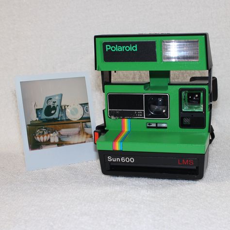 This camera produces either Color or Black-and-White prints depending on the film cartridge you use. Next to the camera is a photo print I just took with this camera using New Color Polaroid Originals film.The Polaroid Sun 600 Camera has the features to take great instant photos without over compli Polaroid Original, Polaroid Cameras, Polaroid Originals, Green Rainbow, Instant Photos, White Prints, Black And White Prints, Vintage Cameras, Photo Print