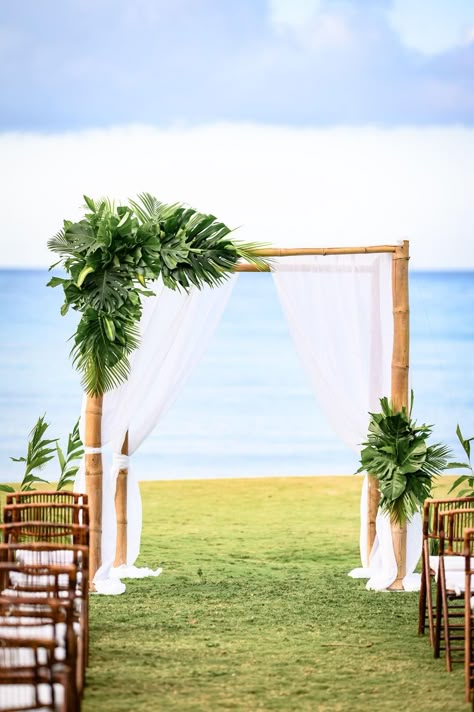 Simple Beach Wedding Backdrop, Arch Flowers Wedding Simple, Beach Wedding Arbor Ideas, Tropical Beach Ceremony, Tropical Beach Wedding Arch, Simple Tropical Wedding Arch, Tropical Wedding Gazebo, Tropical Destination Wedding Decor, Tropical Wedding Alter