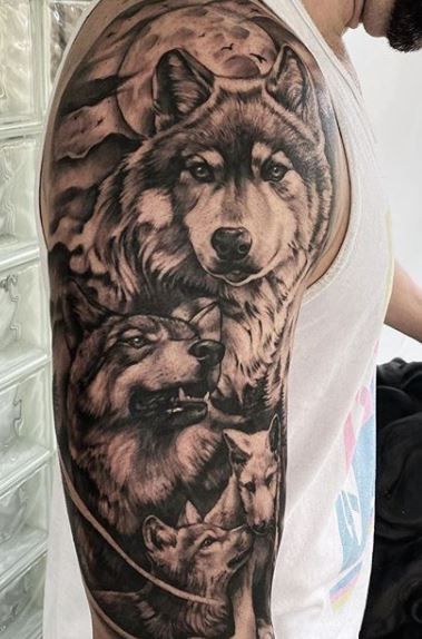 Wolf Tattoos - What's their Meaning? PLUS Ideas & Photos Wolves Tattoo Sleeve, 3 Wolves Tattoo Design, 4 Wolves Tattoo, Father Son Wolf Tattoo, Wolf Family Tattoos For Women, Wolves Family Tattoo, Family Wolf Pack Tattoo, Best Wolf Tattoos For Men, Wolf Mates Tattoo