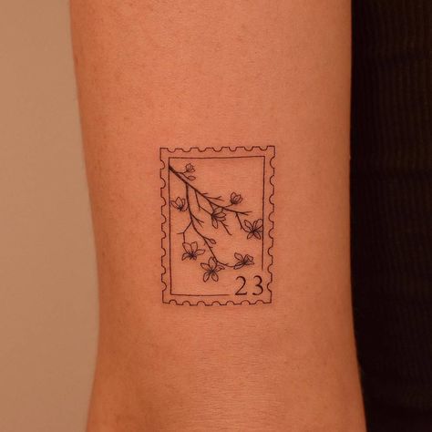 pinterest: hezzprice Floral Tattoo Design Minimalist, Flower Stamp Tattoo Ideas, Floral Number Tattoo, Small Stamp Tattoo Ideas, Post Card Tattoos, Frame Flower Tattoo, Carnation Stamp Tattoo, Post It Stamp Tattoo, Small Icon Tattoos