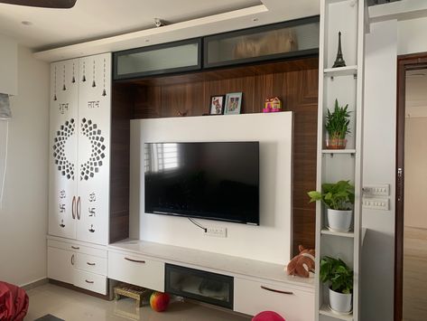 In small apartments havung puja room is a challenge. So habing TV along with the TV unit is one of the best ways to explore in small 2bhk apartments. Simple Tv Unit With Pooja Unit, Simple Tv Unit Design, Tv Wall Ideas, Modern Tv Unit Designs, Tv Unit Design Modern, Simple Tv, Tv Unit Furniture Design, Aesthetic Interior Design, Tv Unit Furniture