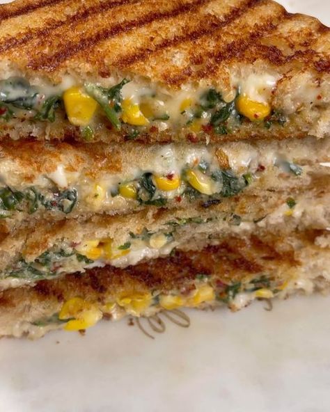 Punam Patil | Pune food blogger on Instagram: "Spinach corn Sandwich Spinach Corn Sandwich is a toasted/grilled sandwich recipe prepared with a creamy and cheesy filling made of spinach, sweet corn, flour, milk, and cheese. It is also flavoured with garlic, pepper, Italian herbs, and red chilli flakes. It is very easy to prepare and tastes better when served hot with tea or soup. Ingredients 1/2 cup milk 4 slices of bread 3 spoon butter 1/2 bowl corn 1/2 chopped spinach 1/2 spoon of red c Sandwich Recipe Videos, Grilled Sandwich Recipe, Spoon Butter, Sandwich Video, Cheesy Corn, Corn Cheese, Soup Ingredients, Italian Herbs, Corn Flour