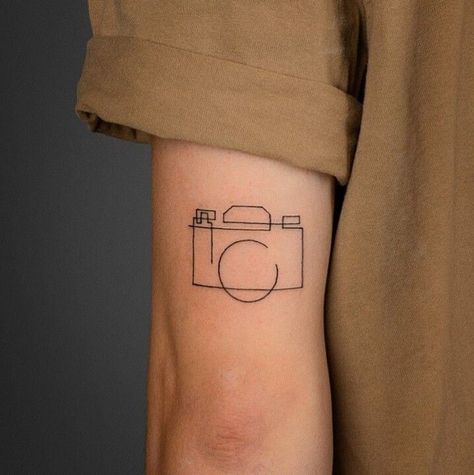 Cinematic Tattoo Ideas, Photographer Tattoo Ideas For Men, Camera Flash Tattoo, Camera Line Tattoo, Camera And Flowers Tattoo, Minimalist Camera Tattoo, Fine Line Camera Tattoo, Photography Tattoo Ideas Men, Camera Tattoo Design Photographers