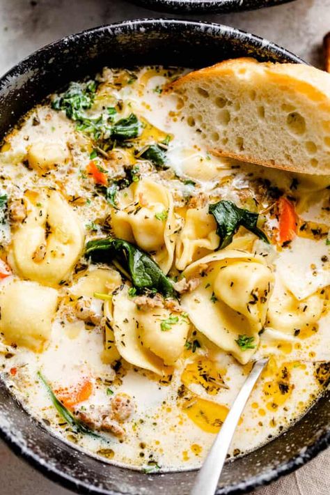 Creamy Sausage Tortellini Soup is a hearty and comforting soup made with cheese tortellini, Italian sausage crumbles, carrots and fresh spinach. It’ll make your taste buds happy! #souprecipes #tortellinisoup #italiansausage #tortellini Creamy Sausage Tortellini Soup, Creamy Sausage Tortellini, Easy Weeknight Recipes, Creamy Tortellini, Quick Soup Recipes, Spinach Tortellini Soup, Sausage Tortellini Soup, Spinach Tortellini, Sausage Tortellini