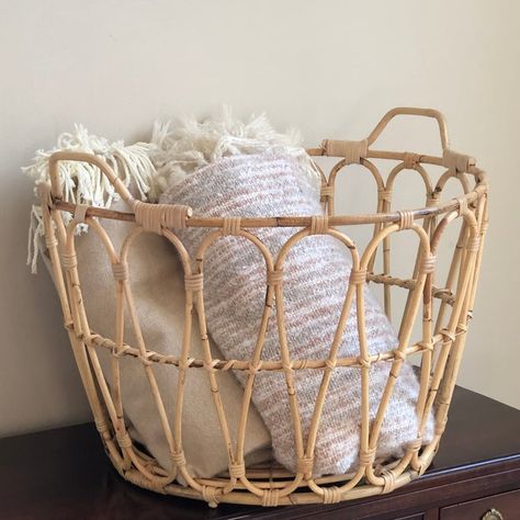 Offering a beautiful Boho-style open weave laundry/storage basket. This is a nice compact rattan basket that holds a lot, but won't overwhelm a smaller living space. Would function well as a working basket in the laundry (and is sturdy enough for that purpose), but can also be put to use in other ways, including as a storage basket (for throw blankets, towels, etc.). A wonderful basket! Boho Basket For Blankets, Rattan Blanket Basket, Basket Of Blankets Living Rooms, Small Wicker Basket Decor Ideas, Blanket Basket Bedroom, Basket With Blankets, Rattan Aesthetic, Wicker Basket Decor Ideas, Modern Beach Bedroom