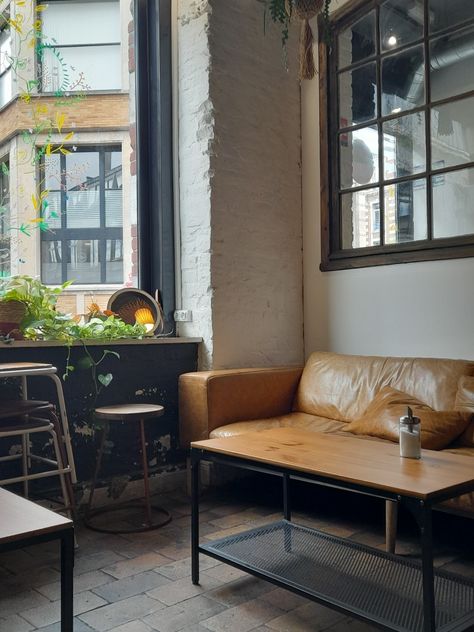 french coffee shop, france aesthetic, rainy day, leather couch, cozy Coffee Shop Couch, Cafe Couch, Cozy Moodboard, Dark Academia Coffee, Aesthetic Rainy Day, French Coffee Shop, Couch Cozy, Corner Seating, France Aesthetic