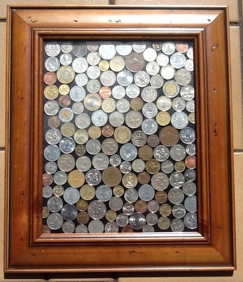 I'll be doing this...eventually.  I didn't keep money from every country I went to, but enough to fill a nice frame.  Hopefully paper money fits well into this idea. Framed Coins Ideas, Art With Coins Ideas, Coins Art Ideas, Money Frame, Coin Frame, Goddess Decor, Wooden Christmas Crafts, Flower Decorations Diy, Photo Wall Decor