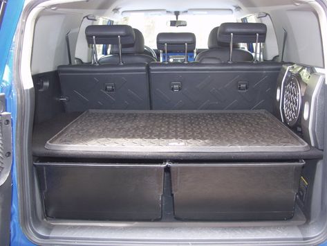 Suv Tool Storage Ideas, Fj Cruiser Camper, Fj Cruiser Camping, Suv Hacks, Jeep Trunk, Fj Cruiser Interior, Fj Cruiser Parts, Suv Trunk Organization, Fj Cruiser Accessories