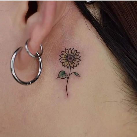 11 Pretty Sunflower Tattoo Ideas for Females 10 Cute Sunflower Tattoo, Tattoo Ideas For Females, Sunflower Tattoo Ideas, Behind Ear Tattoos, Birthday Tattoo, Finger Tats, Hand And Finger Tattoos, Flower Wrist Tattoos, Cute Sunflower