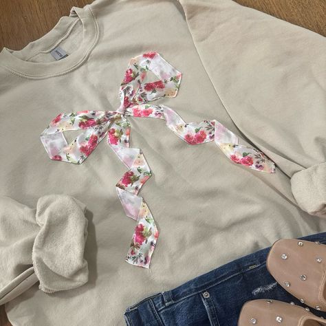 This cute design makes the perfect gift for the bow lover in you life. The beautiful floral bow ribbon is sewn on. Go up in size for a more oversized look. All sales are final due to customization of product. Will ship USPS or UPS unless requested otherwise. Colors and exact shape of bow may differ slightly from appearance on screen. Bow Sweatshirt, Trendy Bows, Clothes Embroidery Diy, Patchwork Clothes, Patchwork Sweatshirt, Cute Ribbon, Sewing To Sell, Diy Sweatshirt, Sweatshirt Trendy