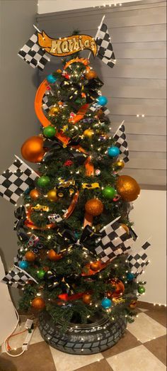 Junky Christmas Trees, Little Boy Room Christmas Tree, Hot Wheels Tree Christmas, Auto Shop Christmas Decorations, French Christmas Tree Ideas, Kid Tree Christmas, Spider Man Christmas Tree Ideas, Little Boy Christmas Tree Ideas, Cookie Monster Christmas Tree Ideas