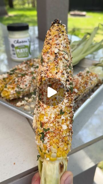 Nick Nesgoda on Instagram: "Grilled Elote Corn with @chosenfoods    This is packed with a ton of flavor and will be the best thing you eat all summer!   Recipe • Soak the ears of corn in water for 10-15 minutes  • Grill the corn at 350°F for 15 minutes indirectly from the heat  • Remove the corn then carefully peel back the husk and discard of the corn silk  • Secure the husk together by wrapping it with 1 husk then tie a knot. This will give you a handle to eat the corn from.  • Mix together ½ cup of Chosen Foods Avocado Oil Mayo, ½ cup of mexican crema and juice from ½ lime.  • Drizzle Chosen Food’s 100% pure avocado oil on all sides of the corn, then grill the corn over direct heat. Remove once you have char on all sides of the corn.  • While the corn cools down, coat it in the cream mi Fire Grilled Corn On The Cob, Corn On The Cob Bar Ideas, Corn On The Grill In Foil, Corn On The Grill In Husk, Corn Recipes Mexican, Elote Corn Recipe, Grilled Elote, Mexi Corn, Corn On The Cob Recipes