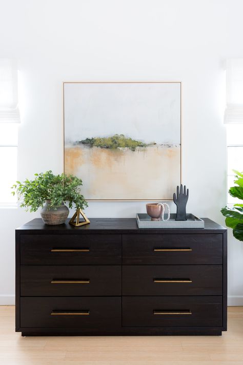 Entryway design + art in entryway + black console table + console table styling + gold accents + light wood flooring + indoor greenery + modern drawer pulls + styling beads | Design by  Lindsey Brooke Design  | Photography by  Amy Bartlam Dresser Decor Bedroom, Modern Drawer Pulls, Black Dresser, Console Table Styling, Black Console Table, Hal Decor, Light Wood Floors, Entry Way Design, Dresser Decor