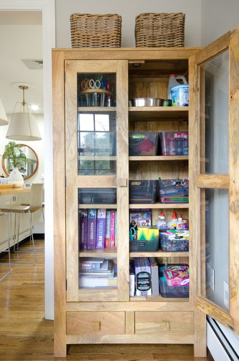 Montessori Playroom Storage Ideas, Art Supply Storage Cabinet, Glass Front Storage Cabinet, Arts And Crafts Storage Cabinet, Art Cabinet Organization Kids, Kids Art Cabinet, Decorative Storage Cabinet, Art Supplies Cabinet, Kids Art Supplies Storage