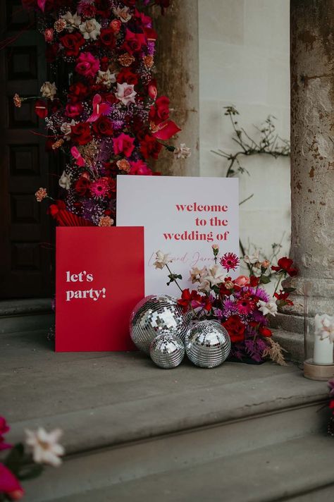 Floral decorations with magenta and pink dahlias, orchids, roses, amaryllis, anthuriums and dried flowers with three disco ball wedding decorations and retro wedding signs | Mark Horton Photos Viva Magenta Wedding, Retro Wedding Theme, Magenta Wedding, Funky Wedding, Disco Wedding, Red Wedding Theme, Disco Theme, Eclectic Wedding, Viva Magenta