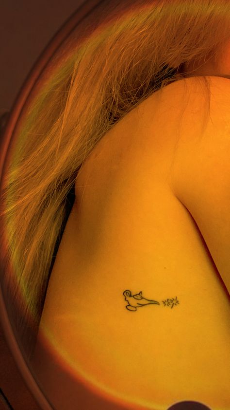 Minimalistic woman tattoo fine line tattoos Disney Aladdin’s lamp genie Princess Inspired Tattoo, Jasmine Tattoo Disney, Disney Tattoos Small Princess, Aladdin Inspired Tattoos, Genie Tattoo Disney, Disney Aladdin Tattoos, Princess Jasmine Tattoo Ideas, Jasmine Tattoo Princess, Aladin Tattoo Ideas