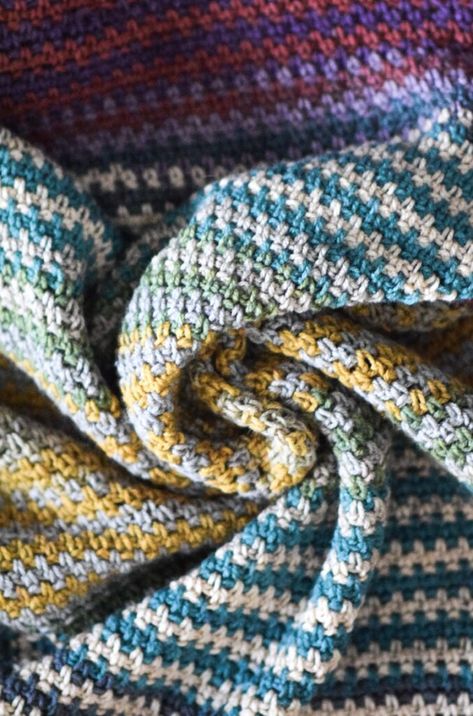 This beautiful striped blanket is so easy and it uses color changing Mandala yarn! There are no color changes or weaving in ends. Free pattern available! Unique Blanket Crochet, Crochet Pattern Throw Blanket, Cakes Yarn Patterns Crochet, Dense Crochet Blanket, Blankets Crochet Pattern Free, Variegated Yarn Crochet Blanket Patterns, Tshirt Yarn Blanket, Crochet Patterns For Mandala Yarn, 2 Tone Crochet Blanket