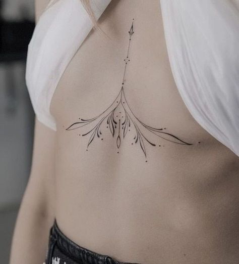 40+ Sternum Tattoo Designs: A Guide To Mandala, Sunflower & More Mandala Sternum Tattoo, Sternum Tattoo Design, Lilac Tattoo, Underboob Tattoo Designs, Small Chest Tattoos, Chest Tattoos For Women, Weird Tattoos, Sternum Tattoo, Line Art Tattoos