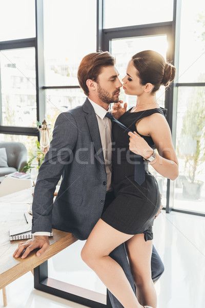 Woman pulling man by necktie stock photo (c) LightFieldStudios (#8479948) | Stockfresh Man Leaning On Table, Man In Suit Sitting, Woman In Black Dress, Dress And High Heels, Man In Suit, Women Necktie, Woman In Black, Couple Poses Reference, Anatomy Poses