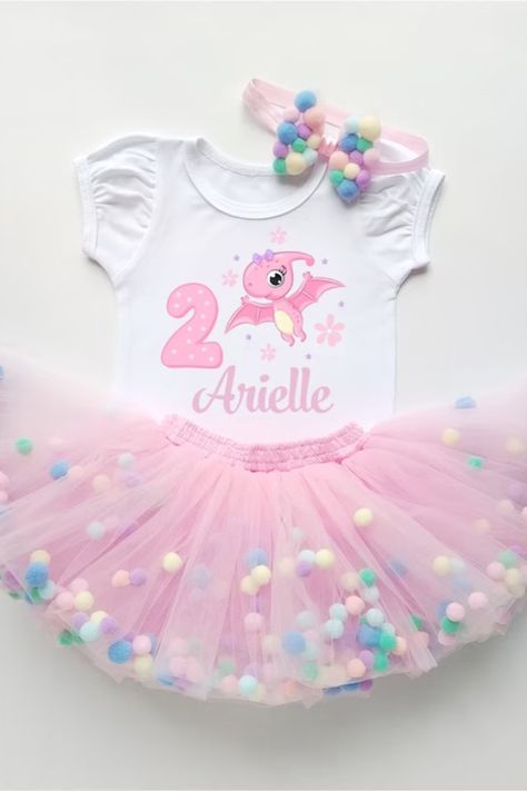 Are you looking for the cutest outfit for your little princess' 1st birthday party? Look no further! At BabyDecoreBoutique, we offer a range of adorable outfits to make your baby girl's Dino Birthday Party unforgettable. From a sweet Dinosaur Birthday Tutu Outfit to an adorable Dino Birthday Shirt, we have something special that they will love! Dino Birthday Shirt, Ballerina Birthday Parties, Dino Birthday Party, Birthday Tutu Outfit, Ballerina Birthday, Dino Birthday, Tutu Outfits, Birthday Tutu, 1st Birthday Party