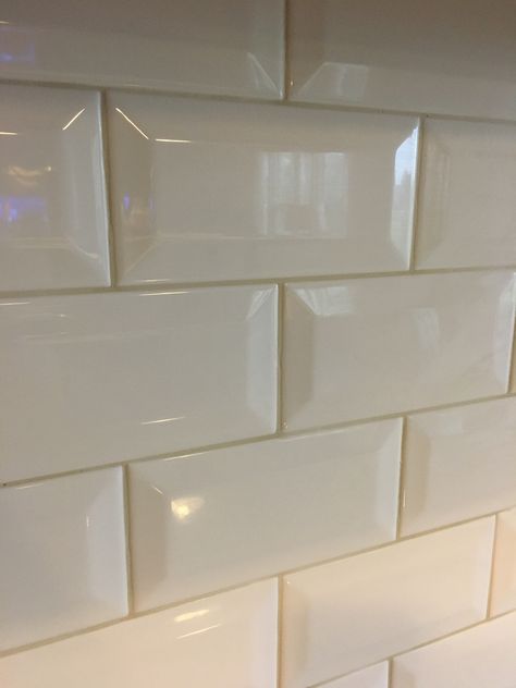 White beveled subway tile with alabaster grout Beveled Subway Tile Backsplash, Metal Backsplash Kitchen, Tile Grout Color, White Beveled Subway Tile, Narrow Kitchen Remodel, Bevelled Tiles, White Kitchen Paint, Beveled Subway Tile, White Kitchen Backsplash