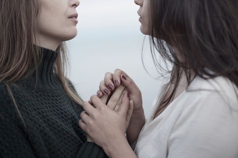 Close up of lesbian couple holding hands by the ocean Dark Academia Wlw, Hand Holding Aesthetic, Two Girls Holding Hands, Holding Aesthetic, Women Holding Hands, Holding Hands Aesthetic, A Lesson In Vengeance, Girls Holding Hands, Hands Aesthetic