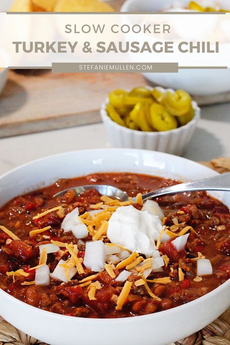 This slow cooker chili recipe has turkey and sausage combined with fresh veggies, roasted tomatoes, chiles and beans. It’s delicious, healthy and the perfect meal for the whole family. Turkey Sausage Chili, The Best Turkey Chili You’ll Ever Taste, Low Fodmap Turkey Chili, Slow Cooker Turkey Pumpkin Chili, Sausage Chili Recipe, Turkeychili Turkey Chilli, Veggies Roasted, Sausage Chili, Slow Cooker Chili Recipe