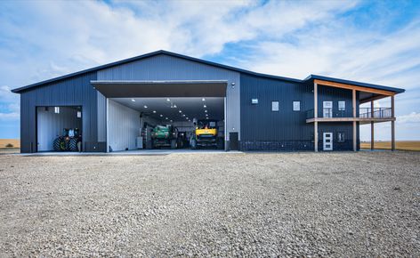 This ultimate farm shop includes a storage area for machinery, a wash bay, and even offices all in a 110' x 120' x 22' post frame building. Farm Shop Buildings, Farm Shop Ideas, Shop Layout Ideas, Tractor Storage, Farm Storage Buildings, Farm Equipment Storage, Ranch Truck, Pole Building Garage, Hangar House