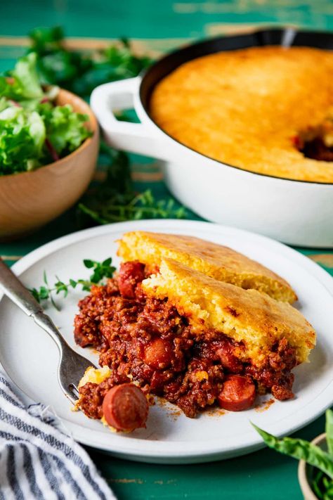 This zesty and flavorful chili dog casserole with a tender Jiffy mix topping is the perfect family supper! The fluffy cornbread crust and a layer of sharp cheddar cheese sit on top of a seasoned ground beef and hot dog filling. It's easy comfort food! Chilli Dog Casserole, Casserole With Cornbread, Hot Dog Casserole, Chili Cheese Hot Dog, Cornbread Crust, Chili Dog Casserole, Chili Cheese Dog Casserole, Fluffy Cornbread, Jiffy Mix