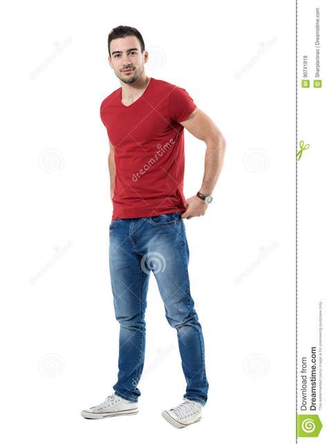 Photo about Friendly young guy adjusting red t-shirt backside looking at camera. Full body length portrait isolated over white studio background. Image of attractive, body, brown - 90741919 White Studio Background, Crossed Arms, Casual Man, Smiling Man, Sneakers Looks, Hand Model, Pose Ref, Red T Shirt, Studio Background