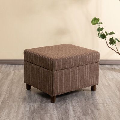 This storage ottoman provides a versatile and stylish addition to your living room, bedroom, or entryway. With a rectangular shape and hinged lid, it offers ample space for storing away extra throw blankets, pillows, and other essentials. The lift-up seat reveals a generous storage compartment, while the walnut-finished tapered wooden legs give it a mid-century silhouette. Upholstered in a gray polyester blend fabric, this ottoman is both functional and lightweight, making it easy to move from r Large Storage Ottoman, Square Storage Ottoman, Round Storage Ottoman, Ottoman In Living Room, Upholstered Storage, Upholstered Ottoman, Hinged Lid, Small Storage, Stylish Storage