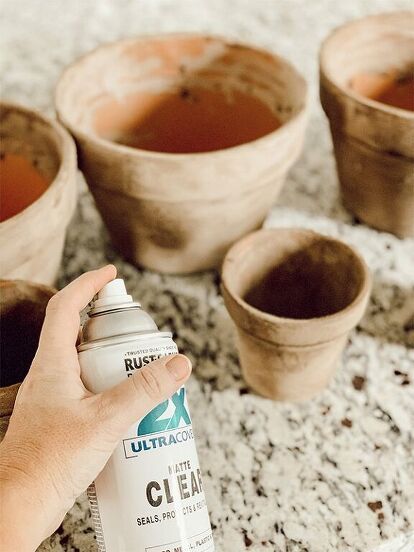 Have you ever wanted something to look old when it's actually new? I used to do this all the time when I was in highschool. I would rip up my brand new jeans in order to give them that worn look. Well, today I want to share an easy DIY project. Aging terra cotta pots. These are so much fun and they truly are SUPER easy! Finished terra cotta pots Don't they look great friends? Get supplies together Place some form of paper on the counter so you don't make a messy. I used a lawn bag f… Age Terra Cotta Pots, Homemade Water Fountains, Marfa Wedding, Aging Terra Cotta Pots, Mosaic Pot, Homemade Chalk, Expensive Decor, Terra Cotta Pots, Ikea Mirror