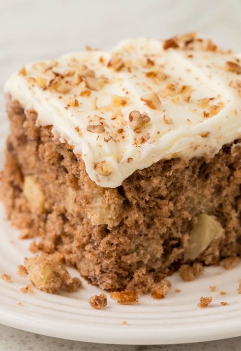 This moist and delicious Apple Spice Cake is filled with warm apple spices, chunks of fresh diced apples, and cream cheese frosting. Spice Cake Using White Box Cake, Spiced Apple Cake With Cream Cheese Frosting, 2 Ingredient Apple Spice Cake, Apple Walnut Spice Cake, Apple Spice Cake Using Box Cake And Pie Filling, Spice Cake Recipes With Raisins, Apple Spice Sheet Cake, Cakes With Apples, Spice Cake Recipes Boxed Apple