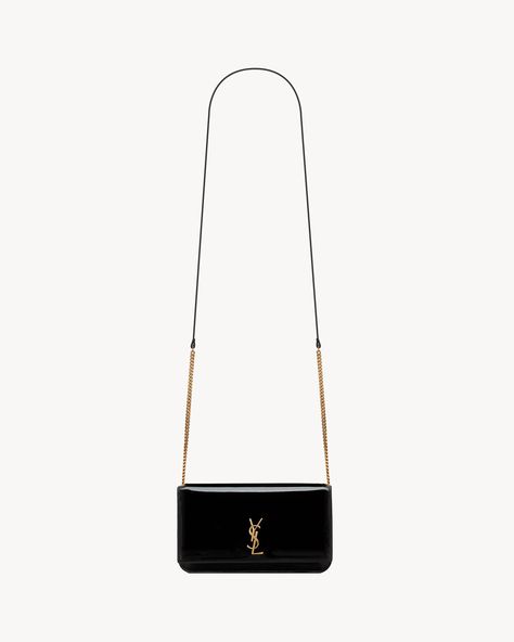 Discover BLACK CASSANDRE phone holder IN PATENT LEATHER from Saint Laurent online store. Saint Laurent Bag, Phone Bag, Phone Holder, Yves Saint Laurent, Patent Leather, Saint Laurent, Phone Case, Online Store, Boutique