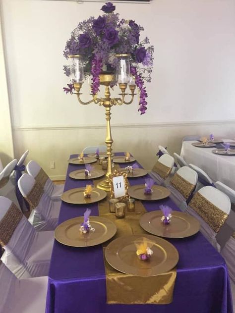 Royal Theme Wedding Regency Purple Satin Table Cloth Gold Satin Tablecloth Gold Charger  White Spandex Chair Cover & Gold Sequin Chair Band 36" Gold Candelabra with Purple Silk Flowers Purple And Gold Centerpieces, Royal Theme Wedding, Bush Party, Masquerade Quince, Purple Gold Wedding, Regency Purple, 16 Party Decorations, Gold Theme Party, Purple Party Decorations