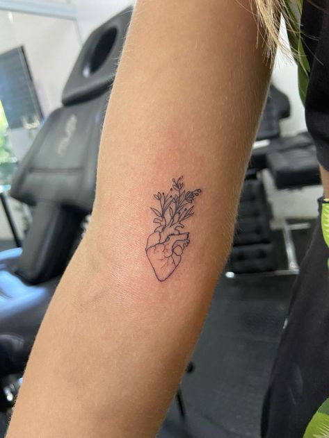 Womens Heart Tattoos, Wearing Your Heart On Your Sleeve Tattoo, Creative Heart Tattoo Design, Heart And Floral Tattoo, Heart Into Flower Tattoo, Growing Heart Tattoo, Heart With Flowers Coming Out Tattoo, Flowers In Heart Tattoo, Human Heart Flower Tattoo