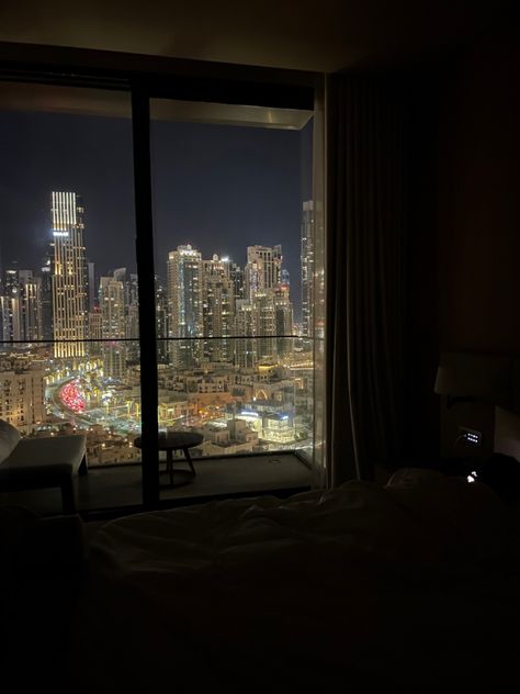 amazing view of dubai at night from hotel room Sky Scrapers At Night, Dubai Room View, Hotel Room Aesthetic Night, Dubai Night View, Dubai Hotel Room, Rooms Wallpaper, Nice Bedrooms, Dubai Night, Hotel View