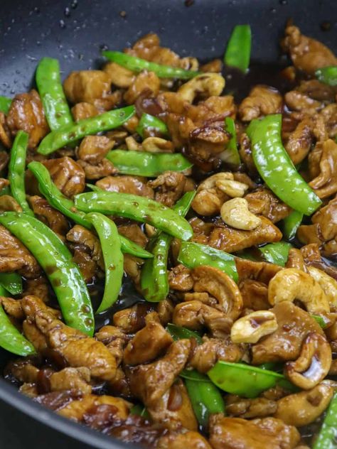 Cashew Chicken with moist chicken, crunchy cashews, and tender-crisp snow peas in a savory brown sauce is easy to make and super tasty. This stir-fry dish uses simple pantry ingredients and cooks in one pan; perfect for busy weeknights! Chicken With Snow Peas, Pork Hamonado, Kawaling Pinoy, Chicken Cashew Stir Fry, Cashew Recipes, Pinoy Foods, Moist Chicken, Chinese Cooking Wine, Simple Pantry