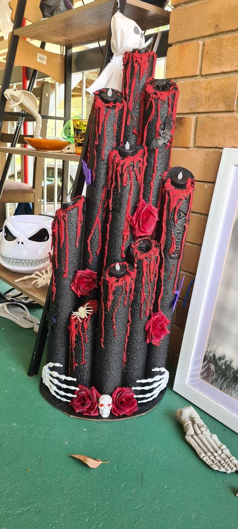 Black painted candles with big red wax dripping down the length. There are blood red roses and bats scattered throughout the piece. Candles Pool Noodles, Candles Made From Pool Noodles, Pool Noodle Candles Halloween, Halloween Noodle Candles, Diy Halloween Candles Pool Noodles, Pool Noodle Birthday Candles, Poolnoodle Diy Halloween Candle, Pool Noodle Halloween, Pool Noodle Candles