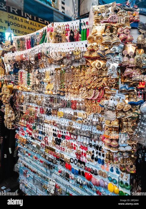 Download this stock image: A shop selling earrings in Delhi's Sarojini Nagar market. - 2BFJXK4 from Alamy's library of millions of high resolution stock photos, illustrations and vectors. Lajpat Nagar Market Snap, Sarojini Nagar Aesthetic, Indian Street Shopping Aesthetic, Sarojini Market Aesthetic, Sarojini Nagar Market Aesthetic, Sarojini Nagar Market Outfits, Delhi Sarojini Market, Desi Shopping, Sarojini Market