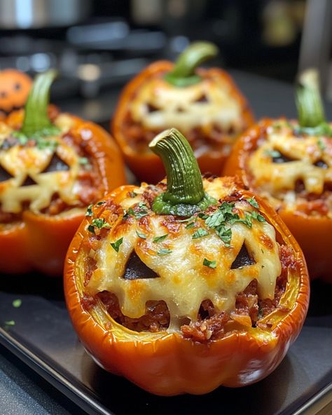 Stuffed peppers are a fun and festive dish for Halloween, especially when you carve the peppers like jack-o’-lanterns! Here's an idea for Halloween Stuffed Peppers that combines flavor and creativity: Ingredients: 6 orange bell peppers (for the "pumpkins") 1 lb ground beef (or turkey for a lighter option) 1 cup cooked rice (white or brown) 1 can (15 oz) black beans (drained and rinsed) 1 small onion (diced) 1 cup tomato sauce 1 tsp cumin 1 tsp smoked paprika 1 tsp garlic powder 1 cup shredde... Stuffed Bell Peppers With Turkey, Halloween Stuffed Peppers, Foil Bake, Idea For Halloween, Rice White, Cooked Rice, Sausage And Peppers, Bell Peppers, Hearty Meals