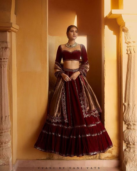 Vvani by Vani Vats Official on Instagram: “𝗠𝗮𝗵𝗻𝗼𝗼𝗿• 𝗪𝗶𝗻��𝘁𝗲𝗿 𝗙𝗲𝘀𝘁𝗶𝘃𝗲 2021 . Our impressive lehenga from Mahnoor has been handcrafted on velvet, making it alluring for all the brides…” Anarkali Velvet Lehenga For Wedding, Maroon Velvet Blouse For Lehenga, Traditional Velvet Lehenga For Festivals, Lehnga Designs Indian Weddings Simple, Festive Red Velvet Lehenga, Lehnga Designs Indian Weddings, Maroon Velvet Lehenga, Velvet Blouse Design, Wedding Outfits Indian