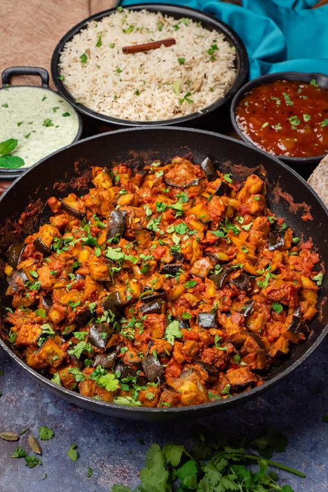 Looking for a delicious, vegetarian recipe that the whole family will love? Look no further than our Brinjal Bhaji Recipe! This popular Indian dish is perfect for a quick and easy weeknight meal. This aubergine curry is packed with healthy ingredients like eggplant, tomatoes, onions, and spices, and can be served with rice or bread. You can make it as spicy or as mild as you like, depending on your preference. So why not give it a try tonight? Aubergine Recipe Indian, Aubergine Curry Indian, Indian Aubergine Recipes, Indian Brinjal Recipes, Brinjal Bhaji, Indian Eggplant Recipes, Keto Indian Food, Brinjal Recipes, Authentic Indian Curry