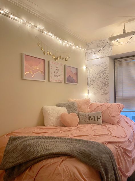 Comforter - target 
White/grey pillows - five below 
Pink pillows - hobby lobby 
HOME pillow - target/iron-on letters 
Throw blanket - dollar general 
Wallpaper - dollar general 
Wall posters - hobby lobby 
Dangling decoration - Etsy 
Lights - target Pink Room Organization, Pink And Grey Dorm Room Decor, Pink White Dorm Room, Pink And White Dorm Room Decor, Grey And Pink Room Aesthetic, Pink Grey Dorm Room, Pink White And Grey Dorm Room Ideas, Dorm Room Designs Pink And White, Pink And White College Dorm